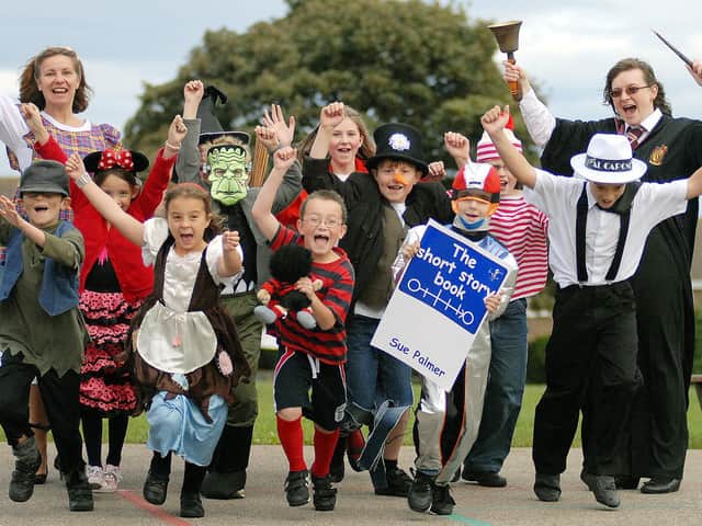 Teachers Jackie Fleming and Emily Firth cheer with Filey juniors as they enjoy World Book Day.