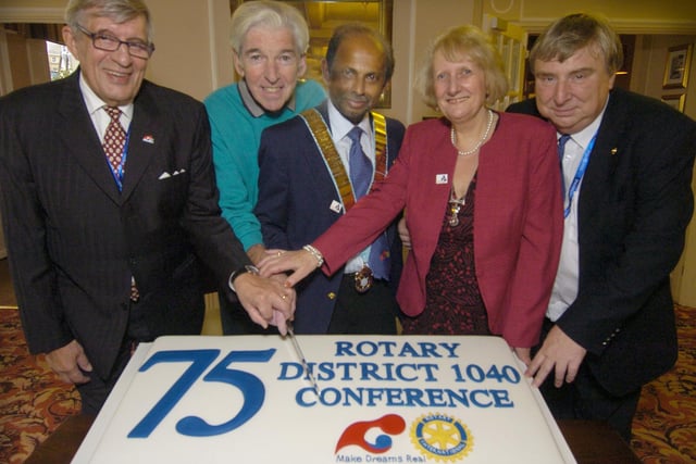 Cutting the Rotary Conference cake, from left: Olavi Wetterstrand, Tom O'Connor, District Governor John Philip and wife Chris Philip, Conference Chairman Willie Clark.
