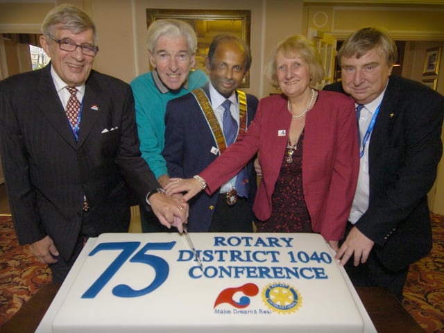 Cutting the Rotary Conference cake, from left: Olavi Wetterstrand, Tom O'Connor, District Governor John Philip and wife Chris Philip, Conference Chairman Willie Clark.