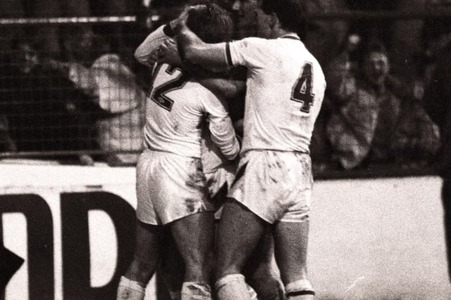 Keith Edwards is mobbed by his teammates after scoring the only goal of the game against Oldham Athletic at Elland Road in the play off semi-final first leg.