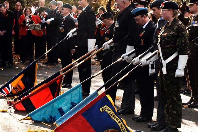 Standards are lowered as the two minute silence is observed during the Remembrance Day service in Spa Gardens in Ripon in 2008.