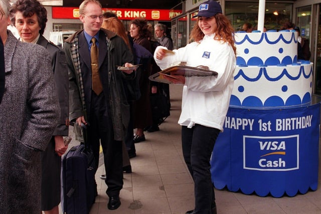 Visa Cash celebrated its first birthday in Leeds by handing out cake to commuters at Leeds City Station.