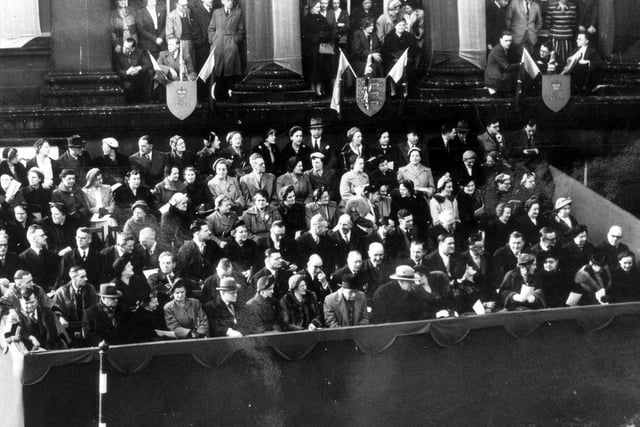 Crowds outside Morley Town Hall for the royal visit of Queen Elizabeth II and Prince Philip. An enclosure was put up for guests to watch the proceedings.