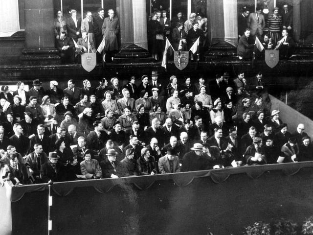 Crowds outside Morley Town Hall for the royal visit of Queen Elizabeth II and Prince Philip. An enclosure was put up for guests to watch the proceedings.