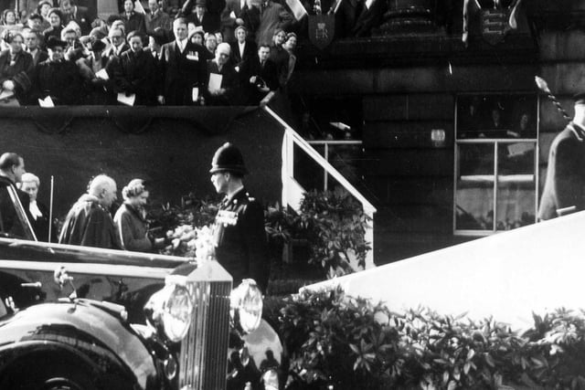 The Queen arrives at Morley Town Hall accompanied by the Duke of Edinburgh, far left. Behind the Queen is Alderman Joseph Rhodes, Mayor of Morley. A special platform accessed by carpeted steps was put up in front of the Town Hall.