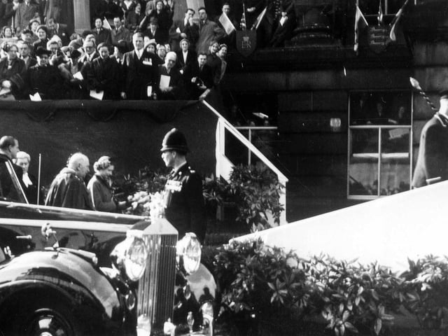 The Queen arrives at Morley Town Hall accompanied by the Duke of Edinburgh, far left. Behind the Queen is Alderman Joseph Rhodes, Mayor of Morley. A special platform accessed by carpeted steps was put up in front of the Town Hall.