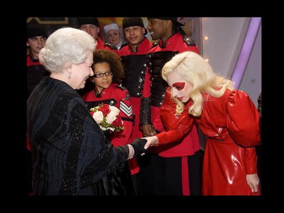 Queen Elizabeth II meets American singer Lady Gaga following the Royal Variety Performance in Blackpool on December 7, 2009