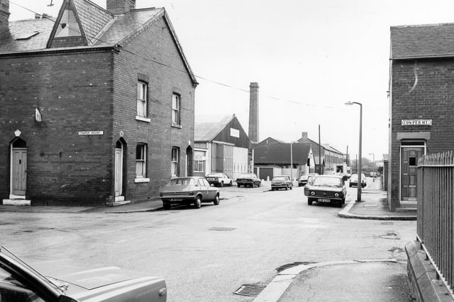 October 1983 and this view looks south-west along Cowper Road. Cowper Mount runs across in the foreground. Railings on the far right surround Harehills Conservative Club which faces onto Harehills Lane.