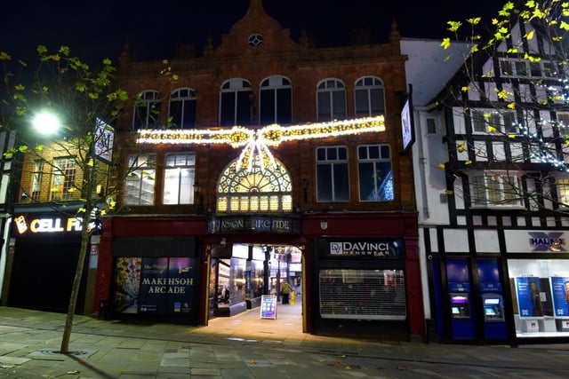 Christmas lights are on as non-essential shops are closed.