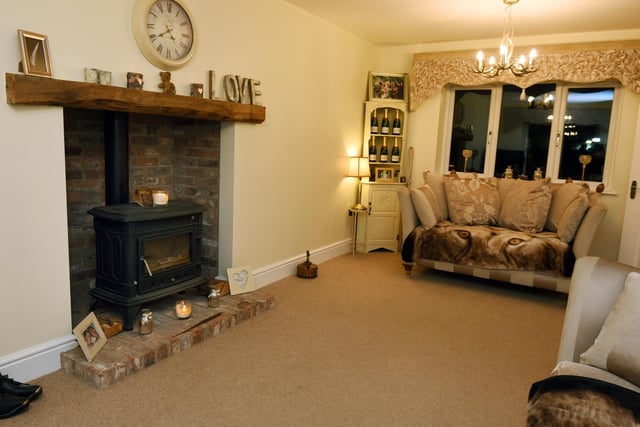 The cosy lounge complete with log burner.