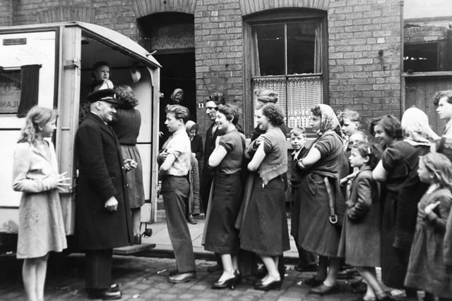 April 1953 and people queue up to be vaccinated on Danube Grove, off Gelderd Road in Leeds.