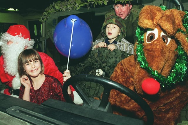 Santa and Rudolf hitch a lift during a party at Carlton Barracks in Leeds with (L-R) Michelle Clenand and Chris Cardiss, and Capt Vaughan Westbrook. The Officer Training Corps organised the Christmas party for the children.