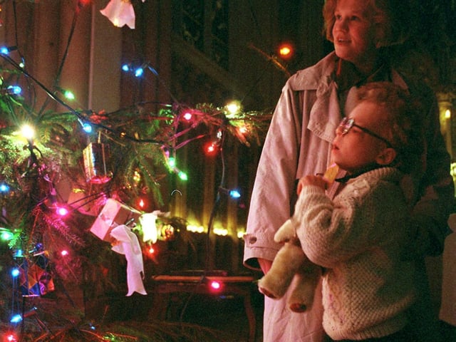 The YEP's Child of Courage, Stephanie Walker, admires the tree which she lit with her mum Dawn at the newspaper's Christmas Carol service held at Leeds Parish Church.