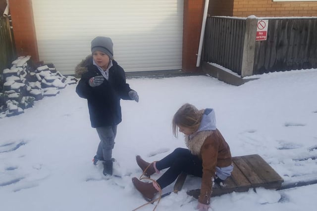 Sammie Winchurch's little ones were up early to make the most of the snow.