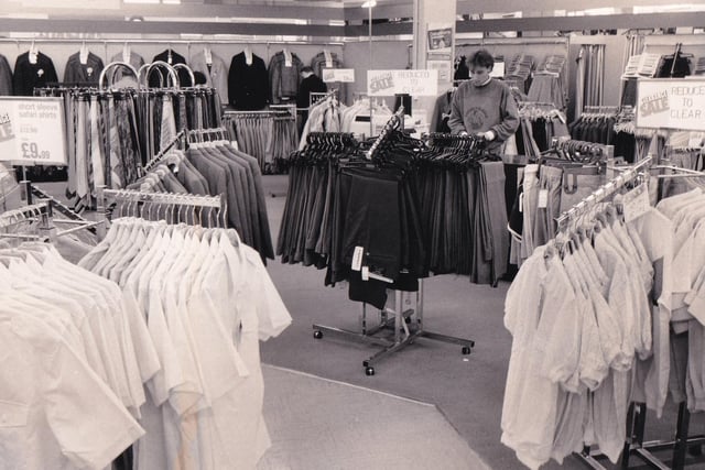 Packed displays of men's clothing at Debenhams in September 1986.