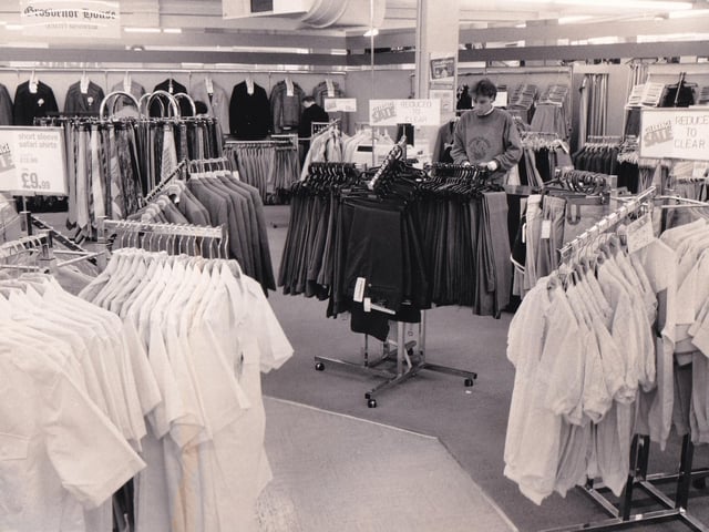 Packed displays of men's clothing at Debenhams in September 1986.