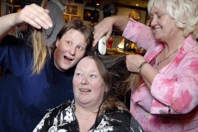 Julie Nichol (L) and Susan Taylor have their head shaved at the Newcastle Packet pub, by landlady Kath Duffy (a former hairdresser), raising over £400 for Scarborough MIND charity.