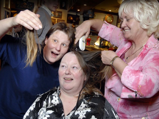Julie Nichol (L) and Susan Taylor have their head shaved at the Newcastle Packet pub, by landlady Kath Duffy (a former hairdresser), raising over £400 for Scarborough MIND charity.