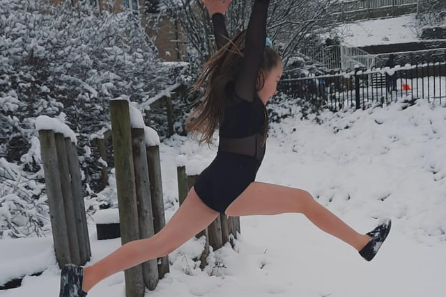 And Elyssa, 7, made the most of the weather to practice her leaps