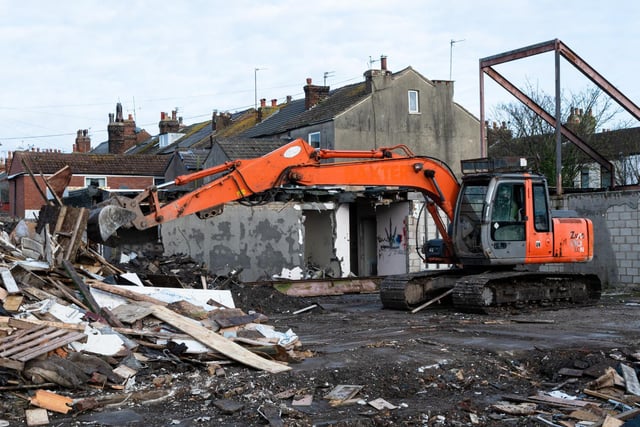 The orange digger ploughs through bricks and concrete as the former Fleetwood Health Centre on London Street comes down. Photo:Kelvin Stuttard