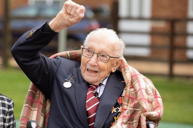 Colonel Tom Moore and his daughter Hannah celebrate his 100th birthday, with an RAF flypast provided by a Spitfire and a Hurricane over his home on April 30