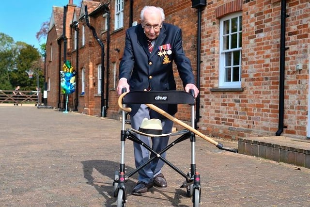 Captain Tom Moore, 99, poses with his walking frame doing a lap of his garden in the village of Marston Moretaine