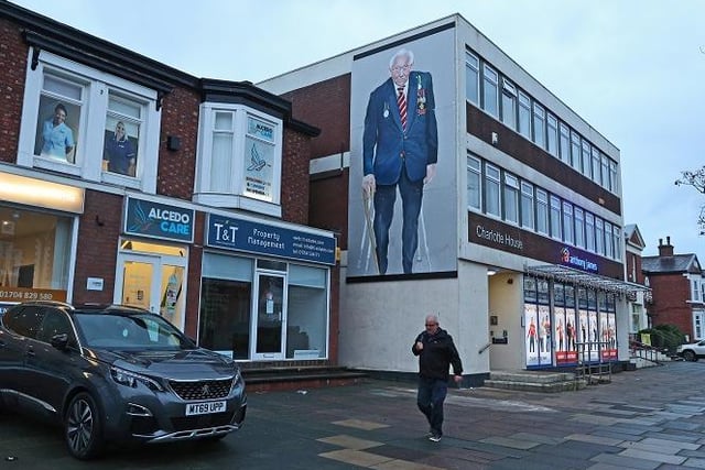 A mural of Captain Sir Tom Moore has been painted on a building in Southport.