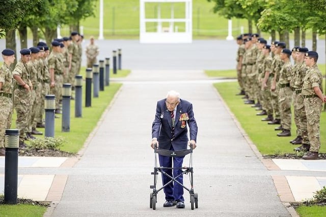 Captain Sir Tom Moore walking down a guard of honour during a visit to the Army Foundation College in Harrogate, North Yorkshire