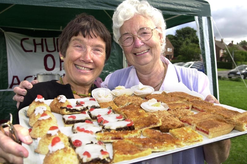 Irene Taylor (left) and Mary Webb raised funds for the Church of the Ascension by selling a mouthwatering selection of cakes at Seacroft Gala in September 2001.
