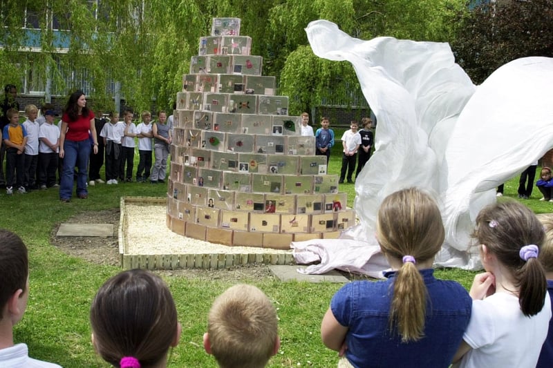 The Secret Garden sculpture made by artists Jennifer Bassham and Michael Day unveiled for local school children at the East Leeds Family Learning Centre in June 2001.