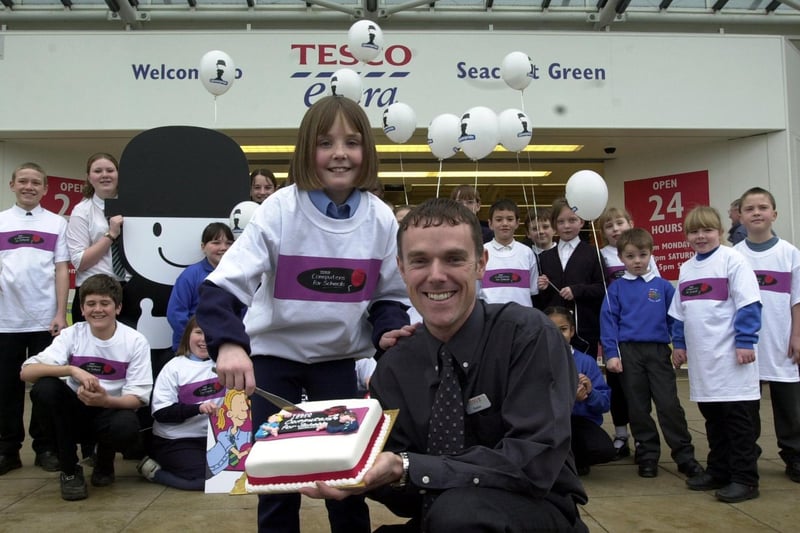 February 2001 and Leane Farrell cuts the celebratory cake with customer services manager Robin Chambers to celebrate the launch of Tesco Computers for Schools 2001 at the supermarket's Seacroft store.