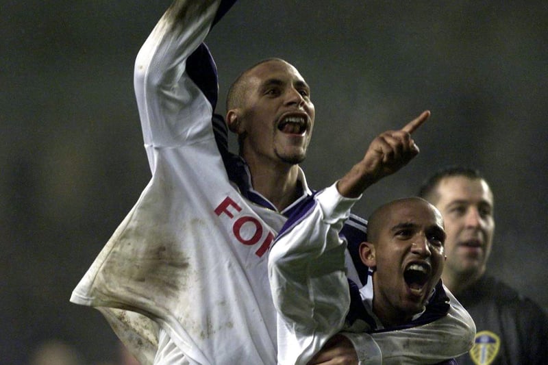 Rio Ferdinand and Olivier Dacourt celebrate Leeds United's 4-1 win at full-time.