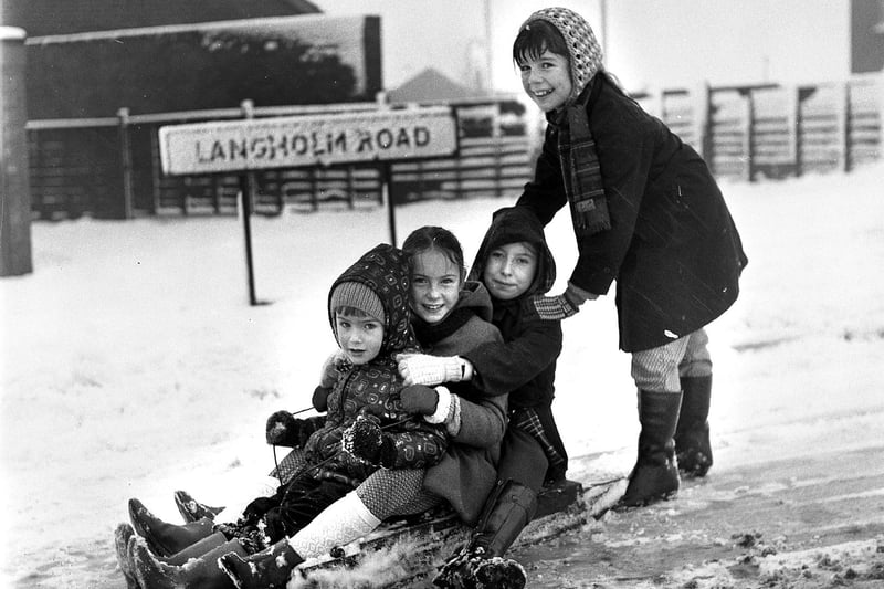 Sledging in the snow at Langholm Road in Ashton in 1973