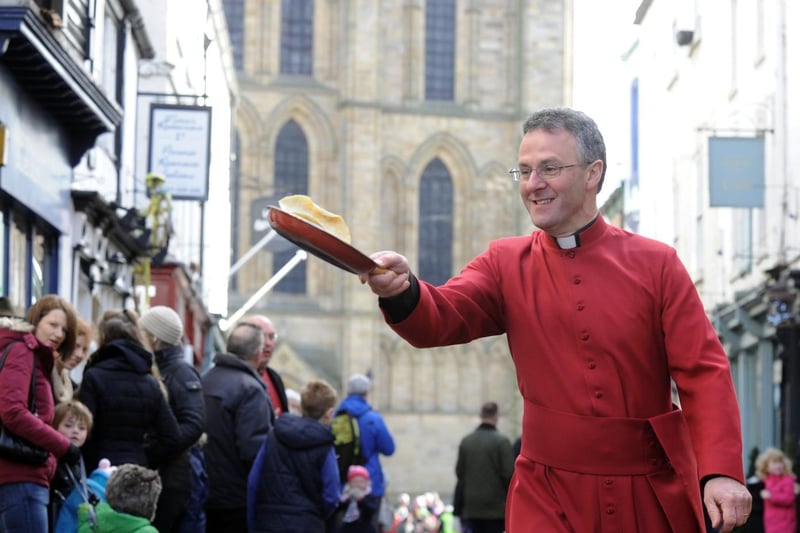 The Dean of Ripon Cathedral, the Very Rev John Dobson taking part in the clergy pancake race in 2015.