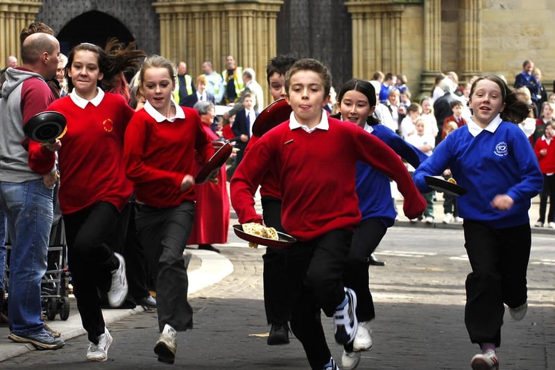 Action from Ripon’s annual pancake race at Kirkgate back in 2009.