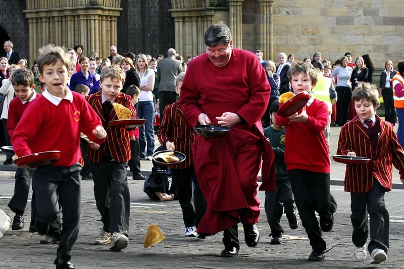 The Dean of Ripon Cathedral, the Very Rev Keith Jukes, gets a head start at the annual pancake race in 2009.