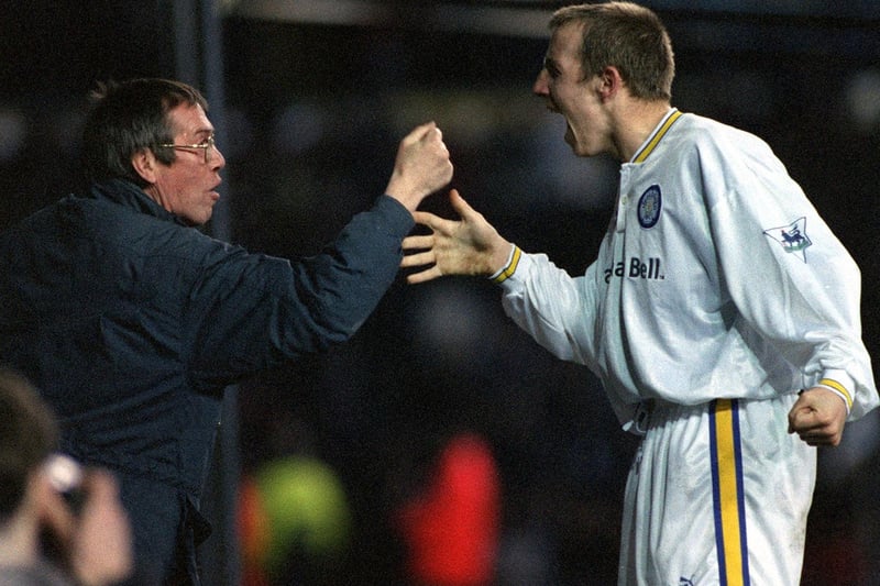 Lee Bowyer celebrates his goal with a Leeds United fan.