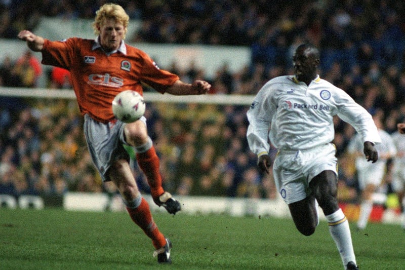 Jimmy Floyd Hasselbaink chases the ball with Blackburn's Colin Hendry.