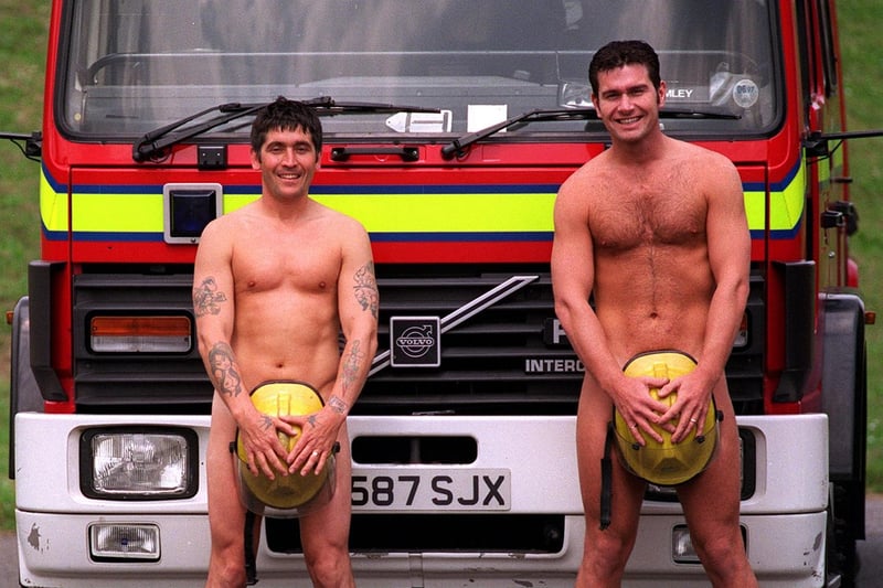 Firefighters Gino Webster (left) and Rob Hart, stripped off to show what you could buy at the slave auction held at the Bramley Fire Station's open day in June 1997.