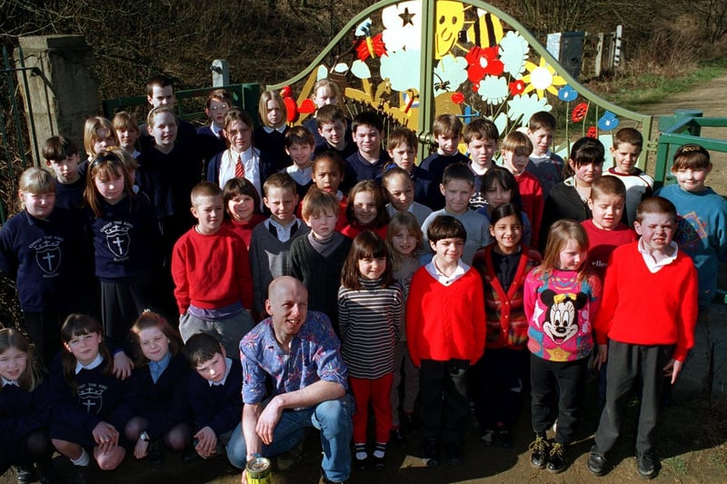 Pupils from Christ the King RC School in Bramley joined children from Burley's St. Matthias CofE in helping design new gates at Kirkstall Valley Nature Reserve. They are pictured with artist Mick Kirby.