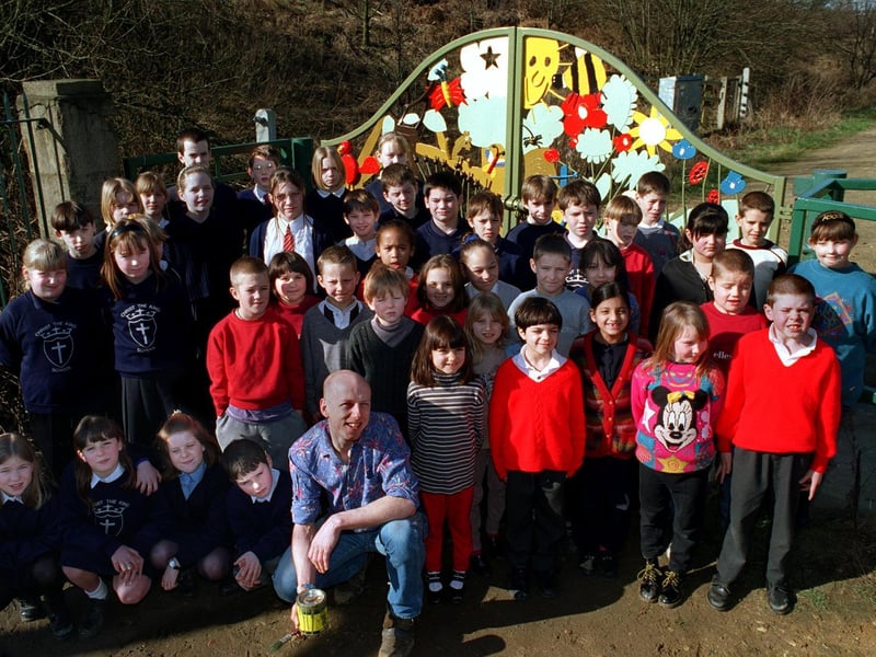 Pupils from Christ the King RC School in Bramley joined children from Burley's St. Matthias CofE in helping design new gates at Kirkstall Valley Nature Reserve. They are pictured with artist Mick Kirby.