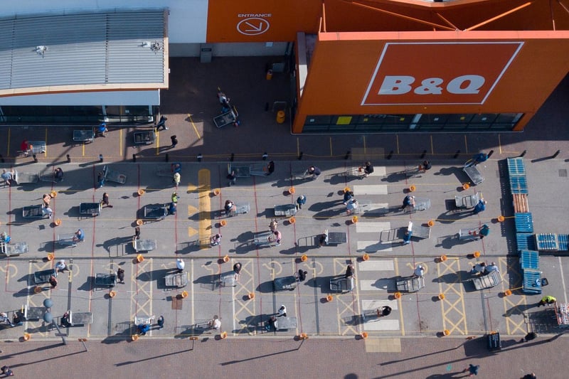This amazing shot of socially distanced shoppers outside B&Q was captured by SWNS news agency