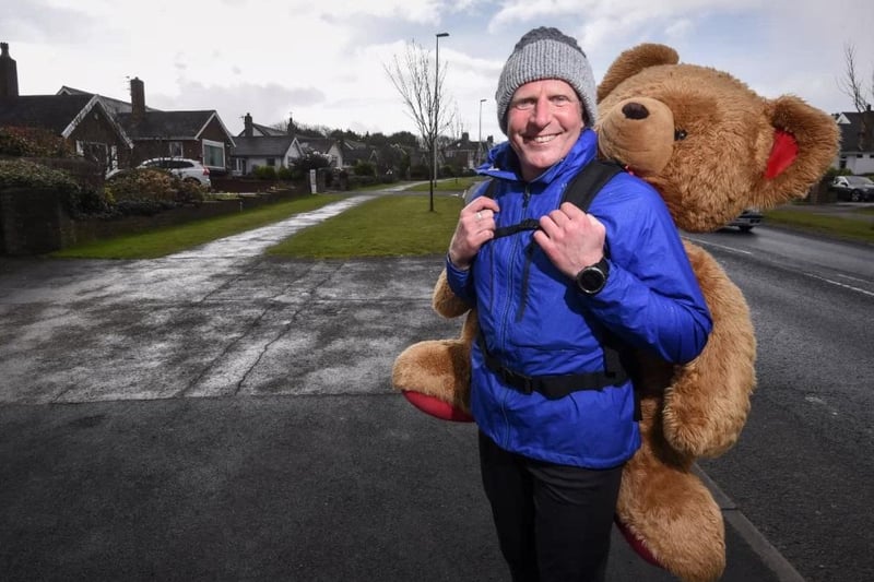 Paul Howlett is raising money for Blackpool's Young Carers by walking up and down Devonshire Road with a two-stone- teddy bear on his back