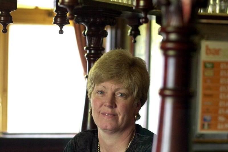 This is landlady Lynne Booth, pictured behind the bar at The Cardigan Arms on Kirkstall Road in February 2001.