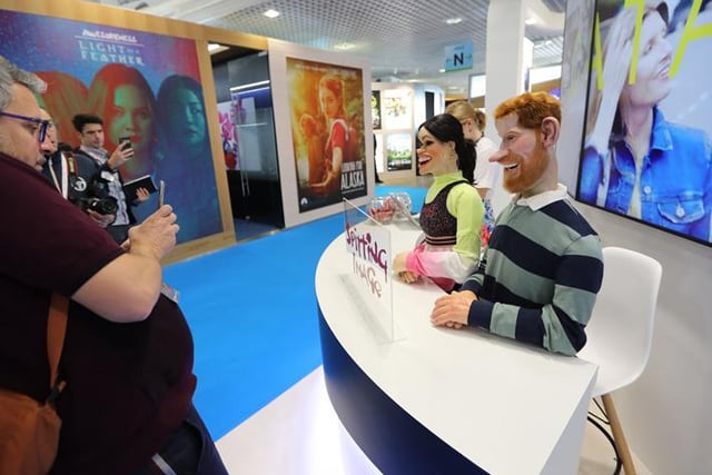 Puppets depicting the Duke and Duchess of Sussex Prince Harry and his wife Meghan, are seen at the stand of British satirical television puppet show " Spitting Image " during the MIPCOM, the World's biggest television and entertainment market