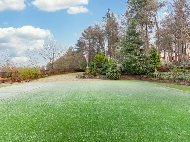 Beautifuly kept gardens and grounds surround the property.