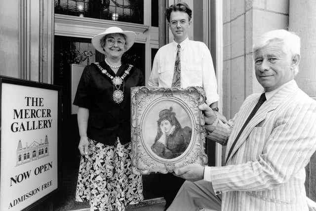 Harrogate’s Mayor, Coun Barbara Hillier and Coun Rodnay Kent accepting two important paintings on behalf of Harrogate’s Mercer Gallery. The pictures were by Victorian artist William Powell Frith and contemporary artist Ban Maile.