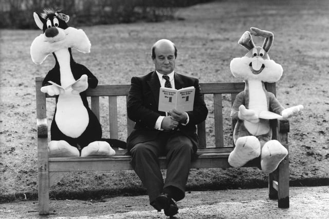 The organiser of Harrogate Toy Fair, Graham Scott, found a quiet corner to relax with Sylvester and Bugs Bunny as they read the Toy Fair guide book.