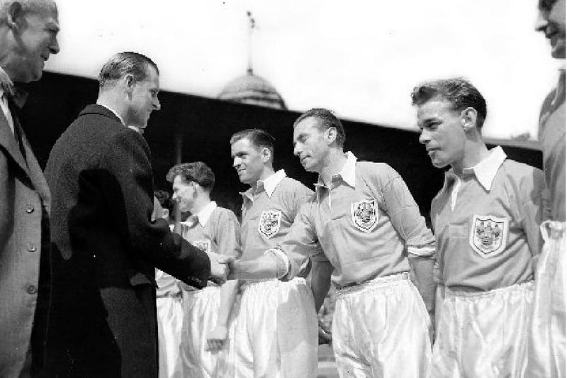 The Duke of Edinburgh shakeing hands with Blackpool's Stanley Matthews before kick off in the Cup Final in 1953
