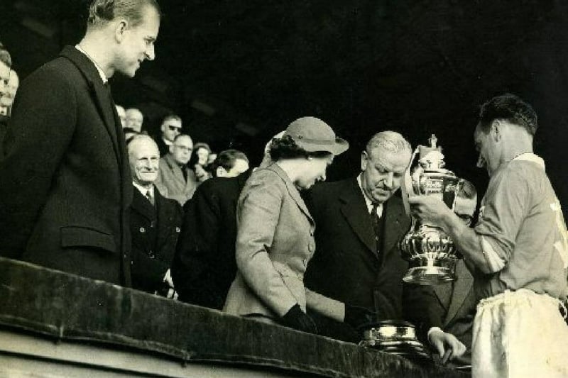 The Queen presents the FA Cup to Blackpool captain Harry Johnston watched by the Duke of Edinburgh and Lord Derby.
Blackpool V Bolton FA Cup Final 2nd May 1953